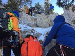 hikers climbing mountain